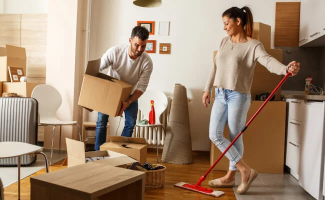 A couple cleaning for end of tenancy